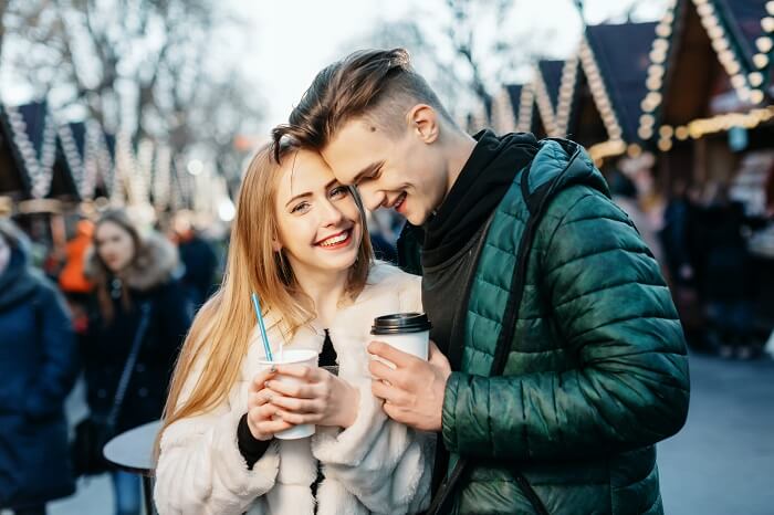 Woman and man with holiday lights